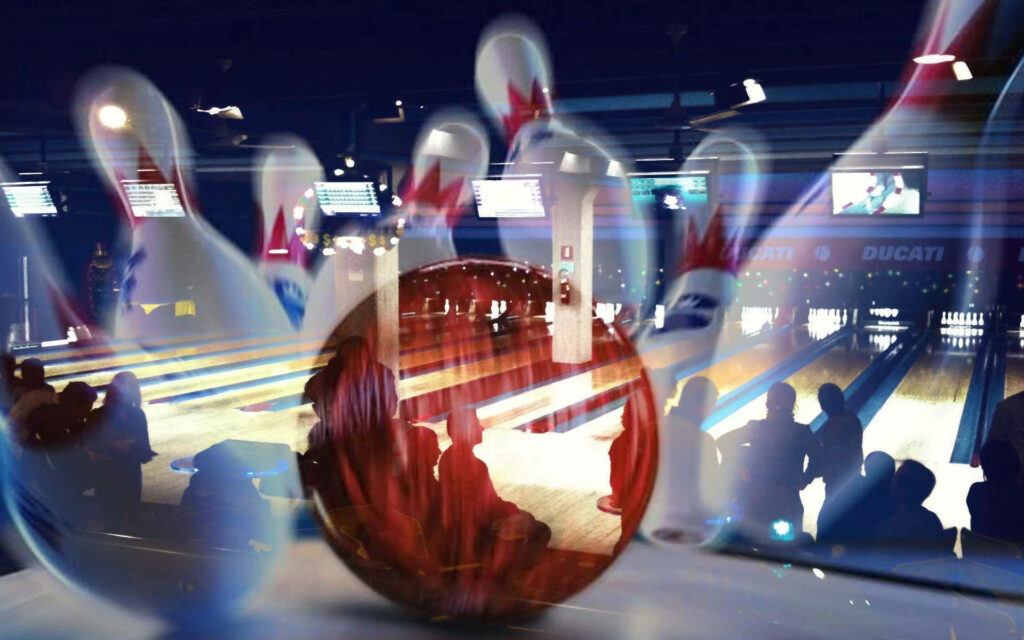 Dynamic bowling game wallpaper with vibrant pins motion blur neon lights and lively crowd background