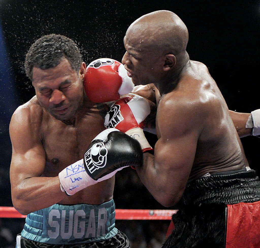 Dynamic Floyd Mayweather Punching Shane Mosley - Boxing Wallpaper