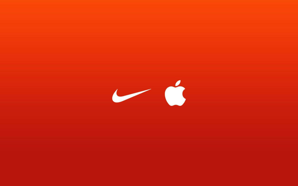 Branding Harmony: Nike and Iconic Logos Unite on Vibrant Red iPhone Wallpaper