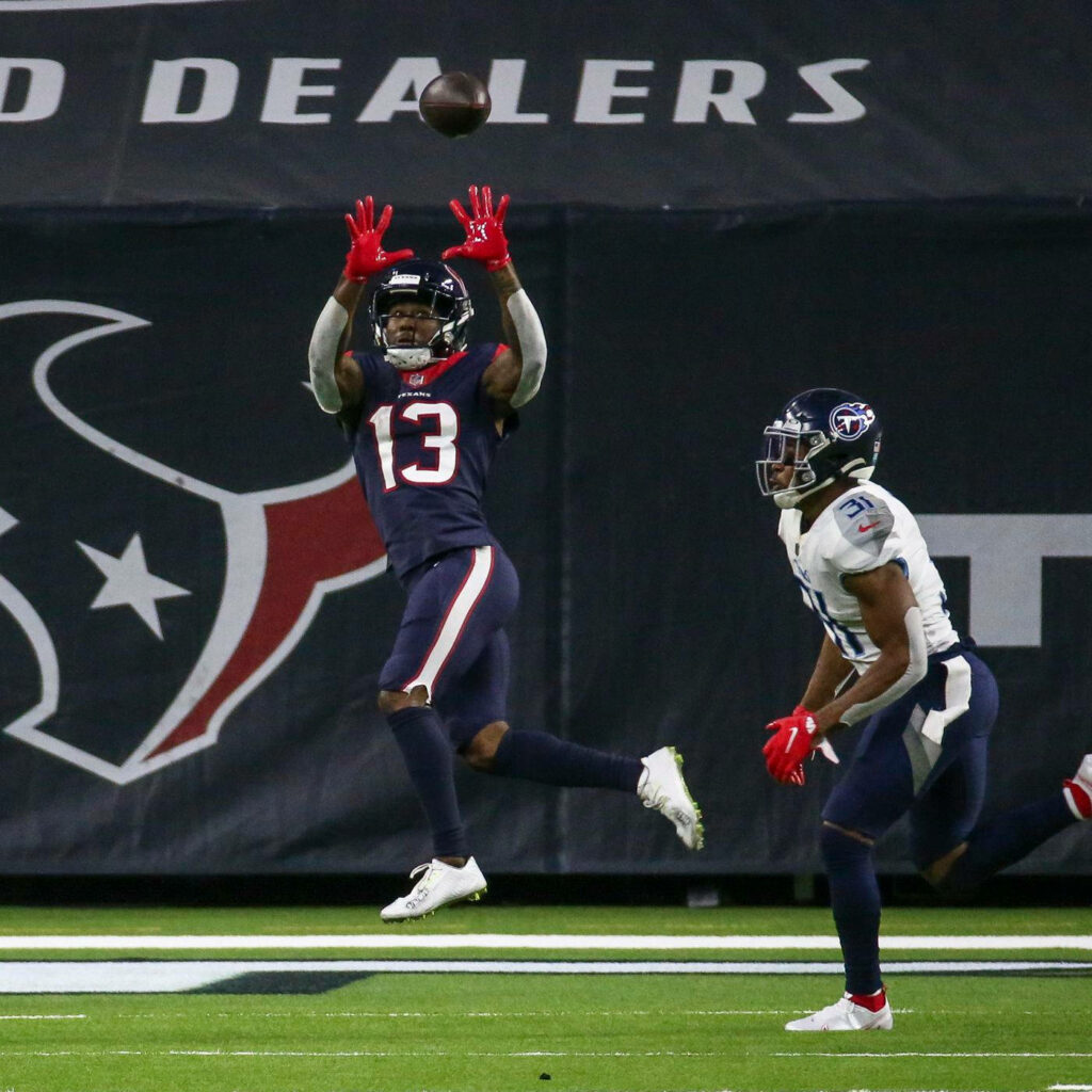 Brandin Cooks leaping to catch football Houston Texans NFL game vibrant team colors action wallpaper