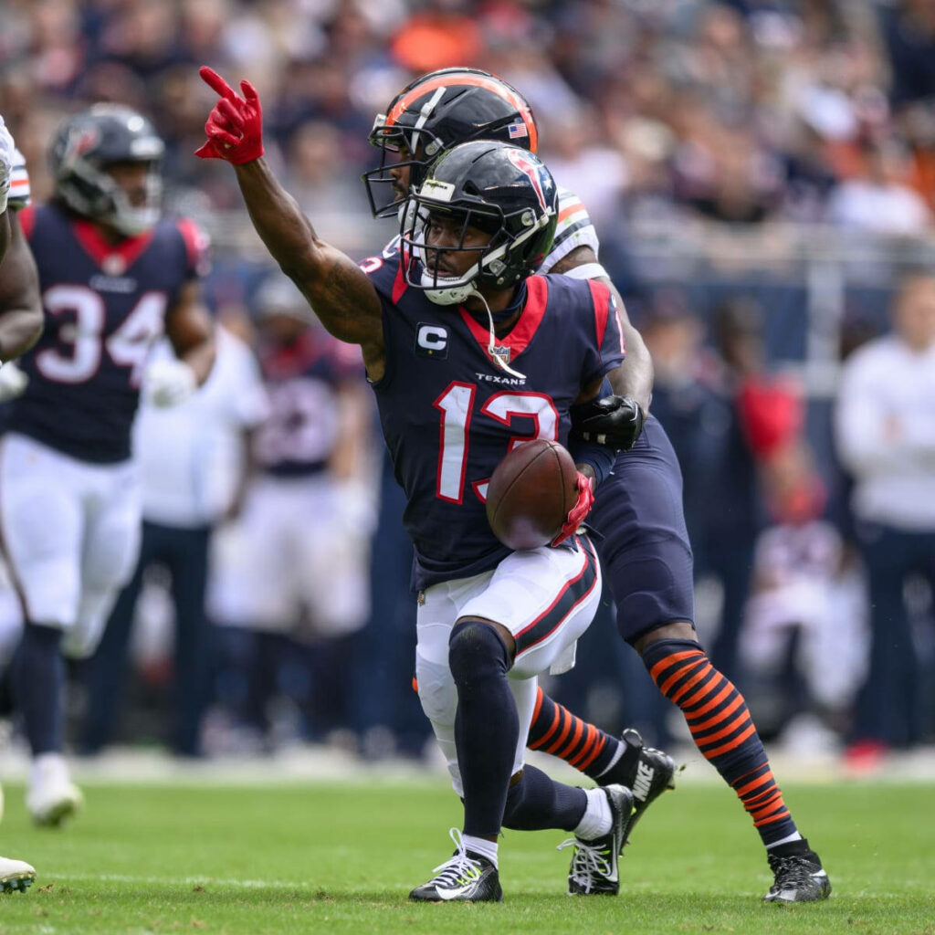Brandin Cooks Houston Texans in action vivid football wallpaper with dynamic athletic pose and colors
