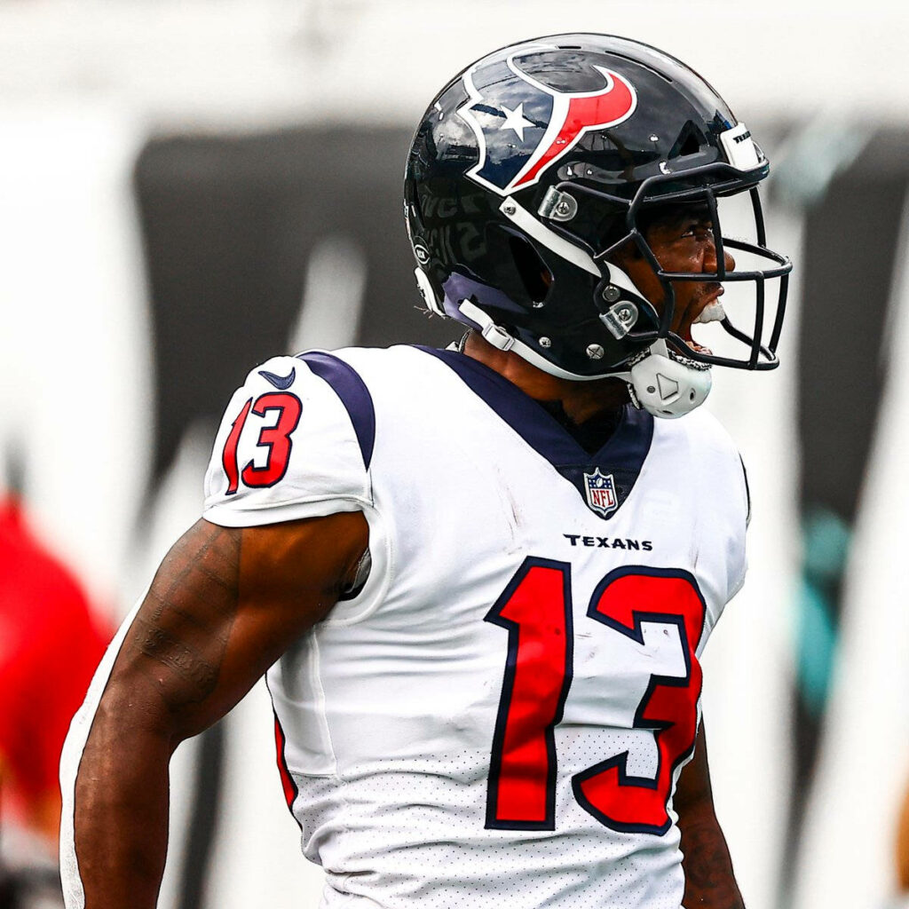 Brandin Cooks shouting in Houston Texans uniform showing intense energy in vibrant NFL wallpaper
