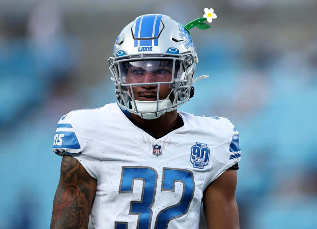 Brian Branch Detroit Lions safety in blue white uniform sharp helmet stadium NFL wallpaper