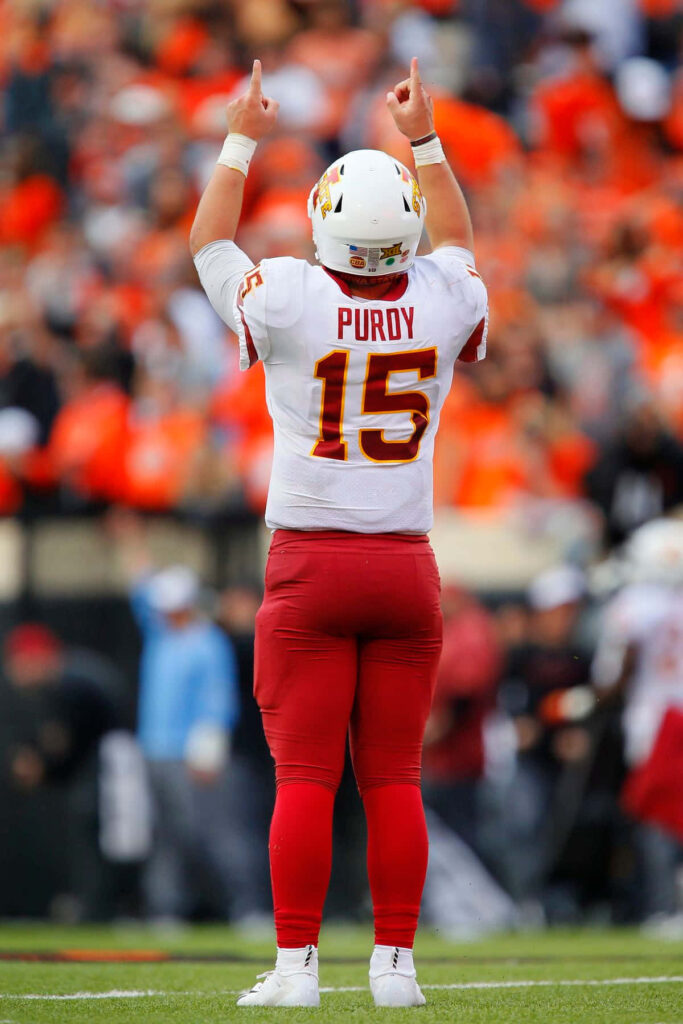Brock Purdy football action wallpaper Signal15 celebrating in white and red number 15 uniform