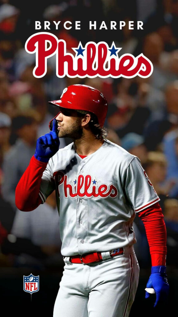 Bryce Harper Phillies wallpaper in iconic uniform confident pose vibrant red white blue stadium background