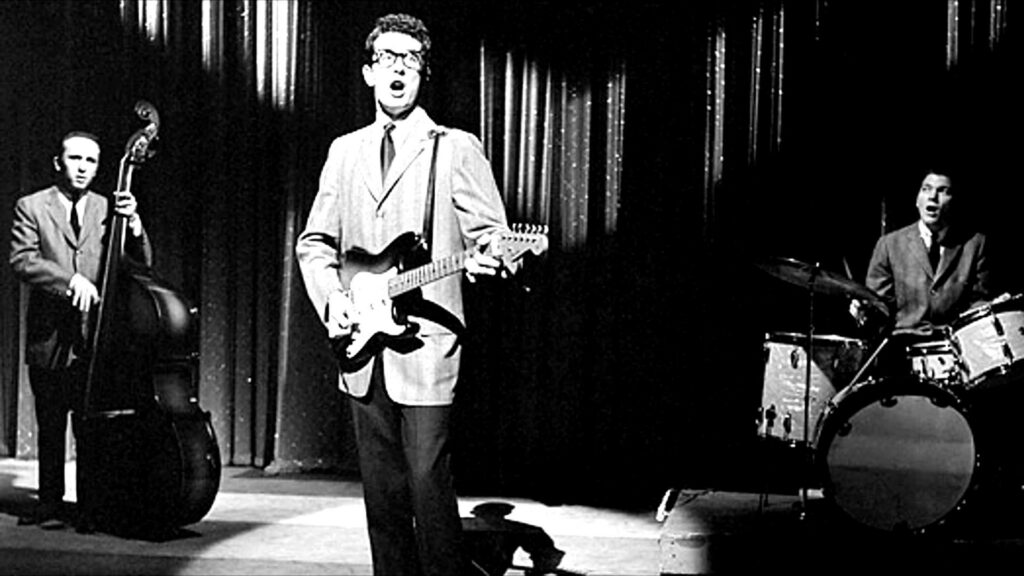 Buddy Holly & The Crickets: Energetic 1950s Rock Performance Wallpaper