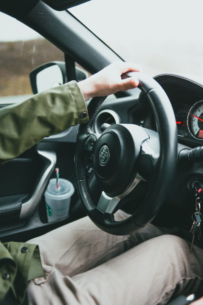 Close-Up Car Interior: Driver's Hand & Dashboard Details Wallpaper