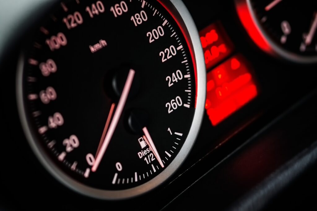Close-Up Car Speedometer Wallpaper: Precision & Speed in Red/Black