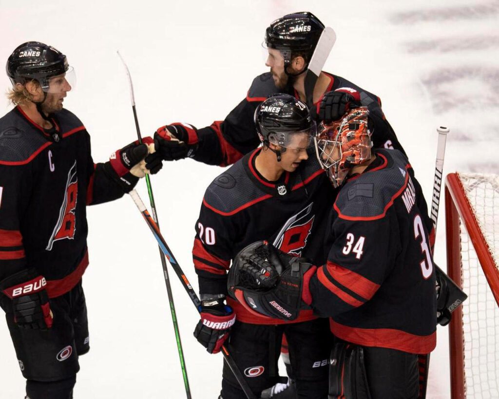 Carolina Hurricanes Celebration Wallpaper: Aho Thrills on Ice