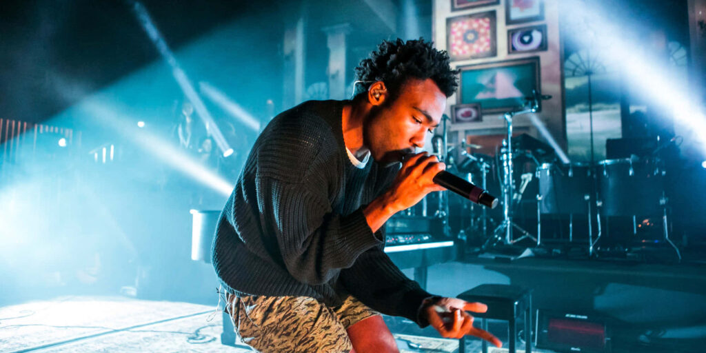 Vibrant Childish Gambino Live Performance Wallpaper Background