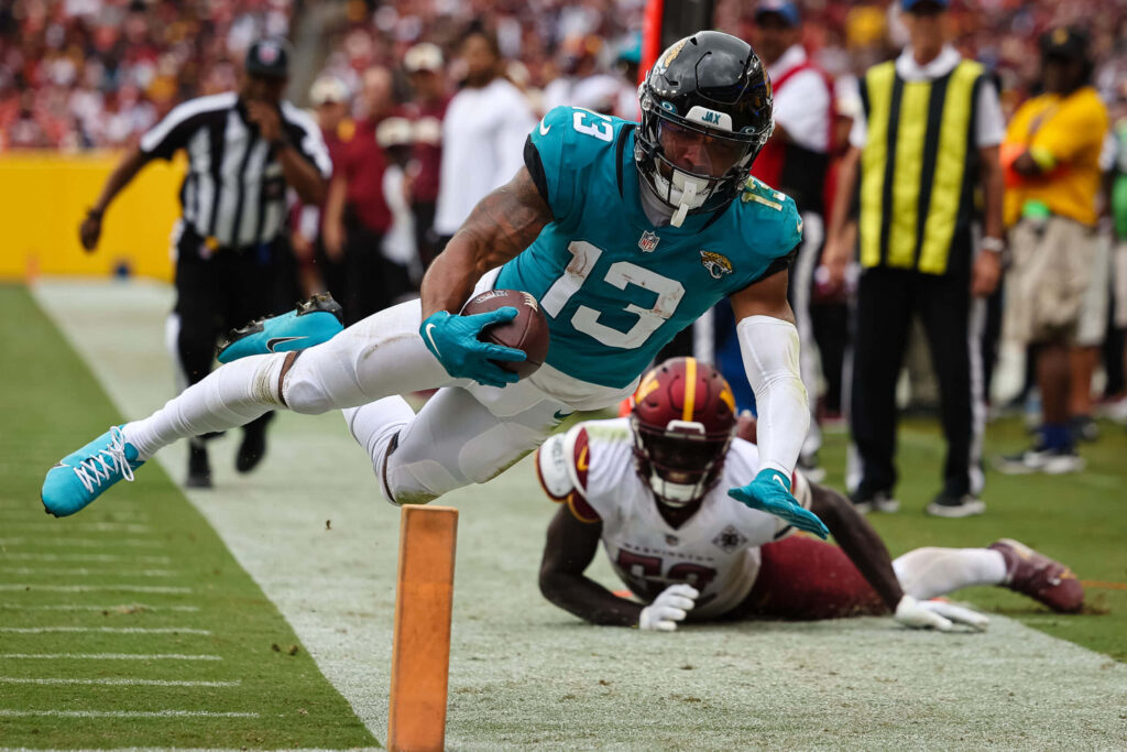Dynamic Football Wallpaper: Christian Kirk's Intense End Zone Dive