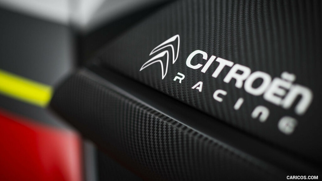 Dynamic Citroën Racing Logo Wallpaper on Carbon-Fiber Background