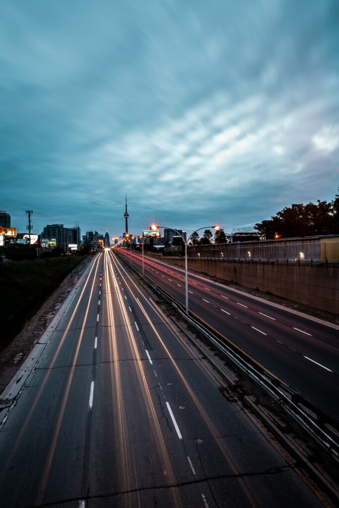 Dynamic City Evening Wallpaper: Urban Lights & Moody Skies