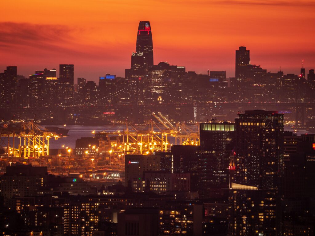 Stunning Cityscape Sunset Wallpaper with Illuminated Architecture