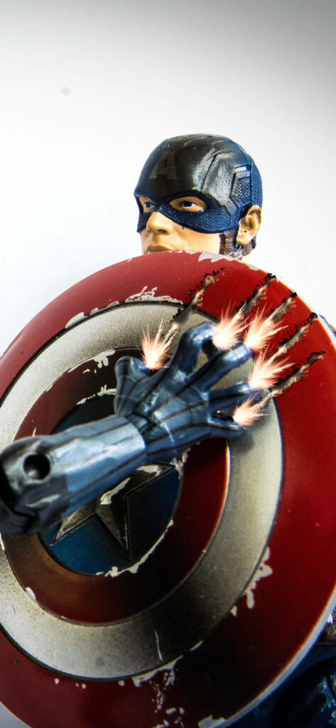 Superhero Clash: Captain America and Black Panther Face Off Wallpaper