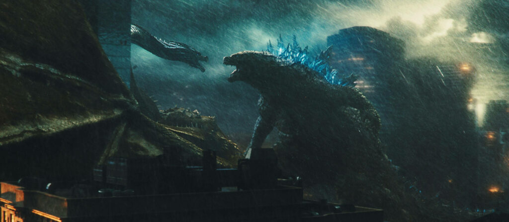 The Clash of Titans: Intense Battle of Monstrous Proportions in 'Godzilla: King of the Monsters' Wallpaper