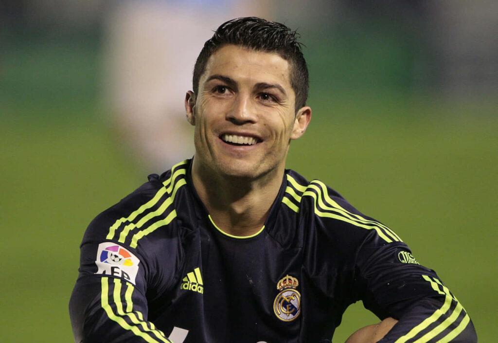 Dynamic Cristiano Ronaldo Wallpaper: Action-Packed Real Madrid Background
