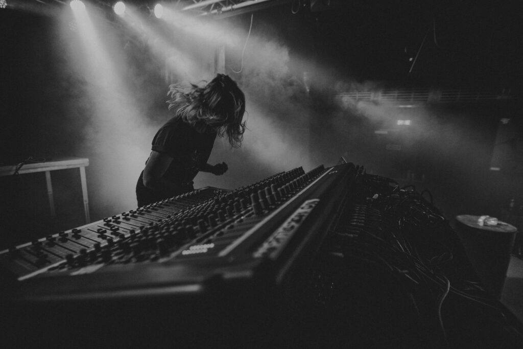 Dynamic DJ Performance Wallpaper: Passionate Energy in Black & White