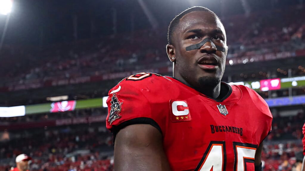 Devin White Buccaneers linebacker intense close-up in red black uniform vibrant stadium lighting Wallpaper