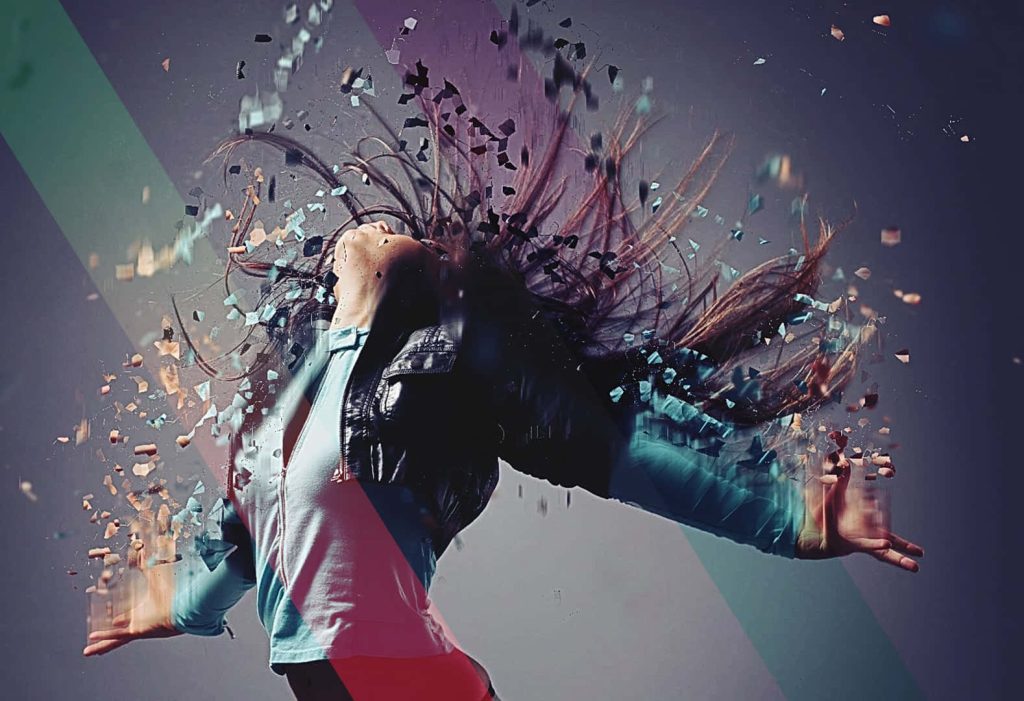 Person with long hair dispersing into geometric particles digital art wallpaper background