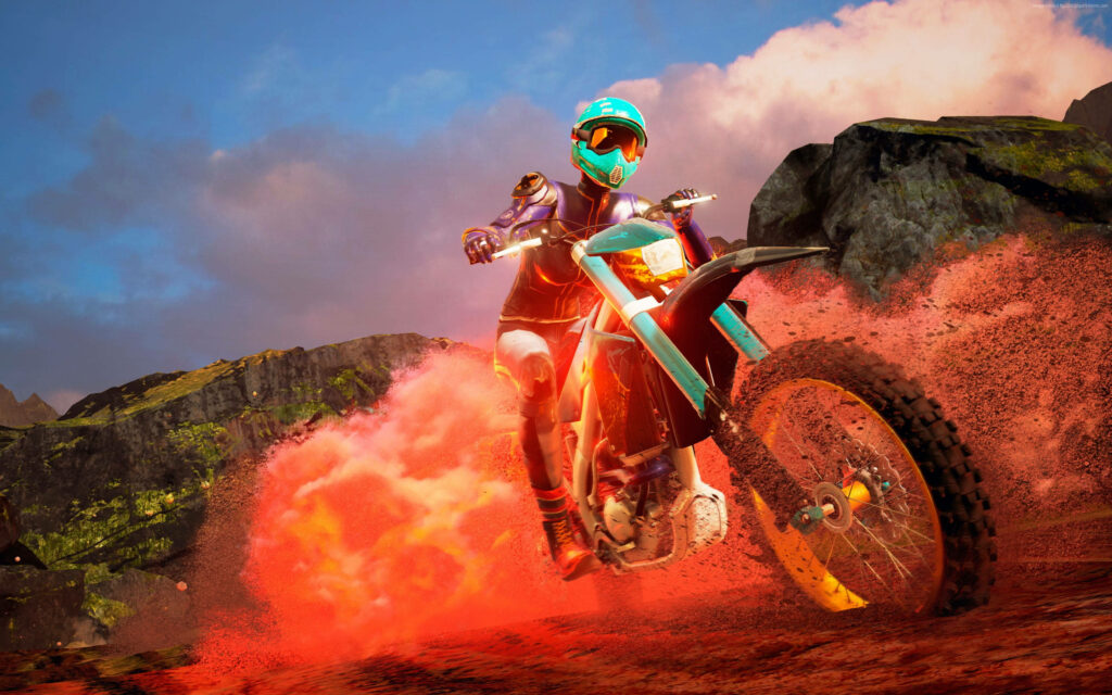Dirt bike rider racing on red terrain with dust clouds and mountain backdrop under blue sky Wallpaper