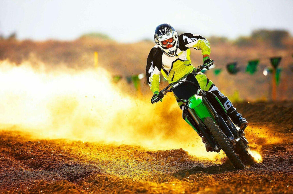 Thrilling Dirt Bike Action Wallpaper: Intense Off-Road Adventure