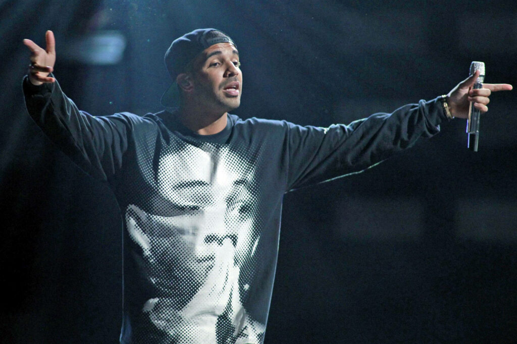 Drake Performing on Stage: Candid Wallpaper Background in Sweatshirt