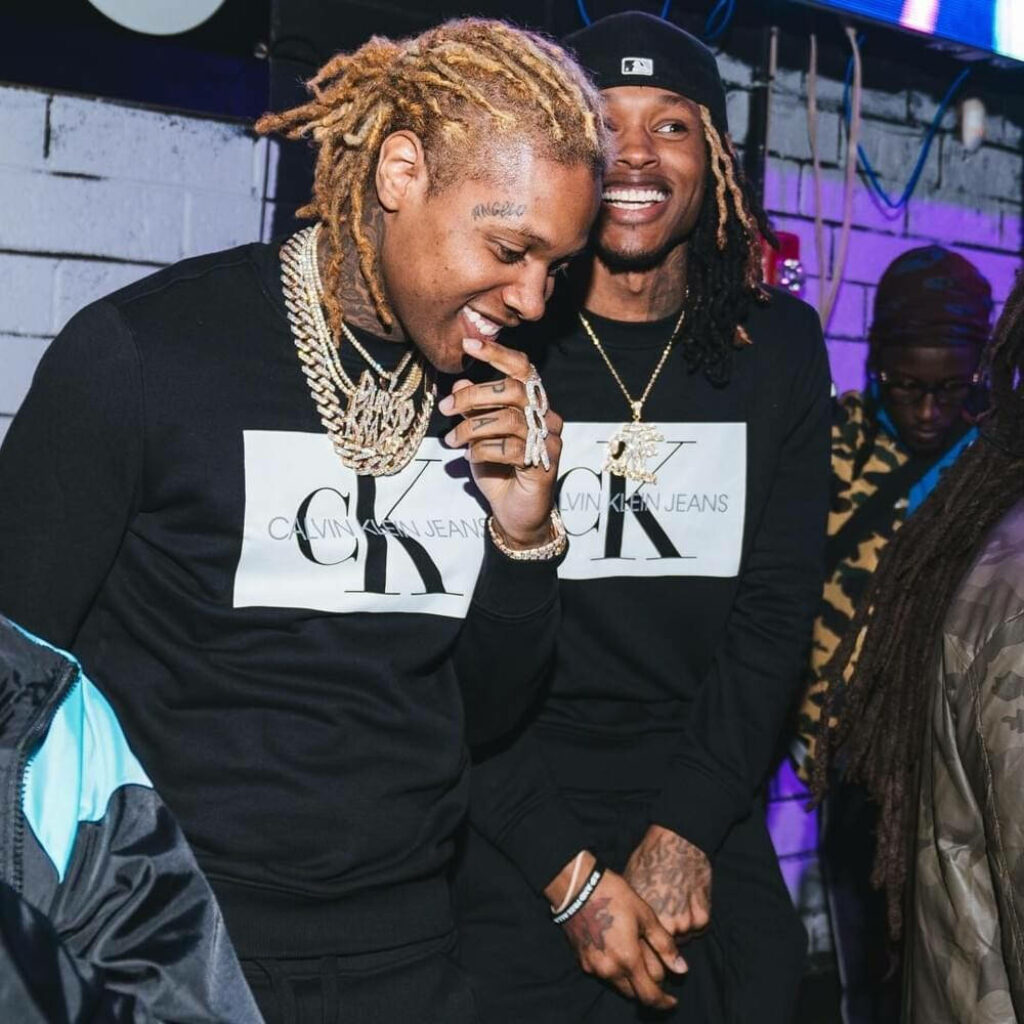 Dapper Duo: King Von and Lil Durk Rocking Black Calvin Klein Jeans Sweaters Wallpaper