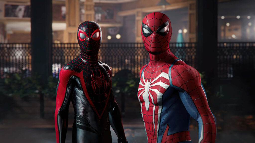 Dynamic Duo Unite: A Captivating Snapshot of Spider-Man and Miles Morales in Perfect Harmony Wallpaper