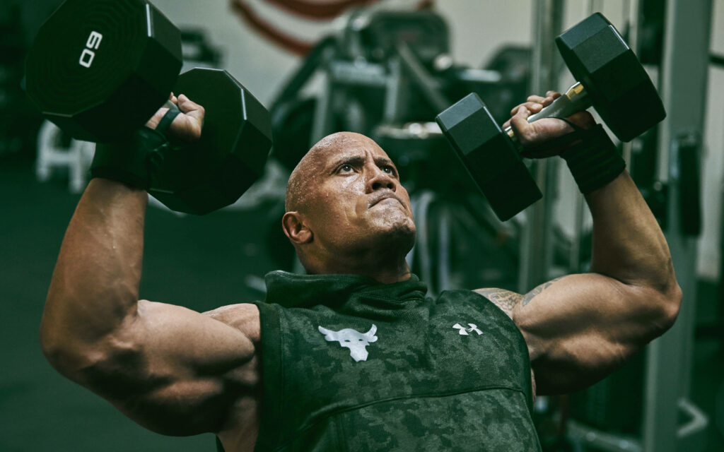 Dwayne Johnson Wallpaper: Intense Strength & Dedication in Gym