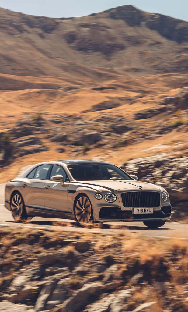 Alluring Bentley Flying Spur Stealing the Show on Endless Highways Wallpaper