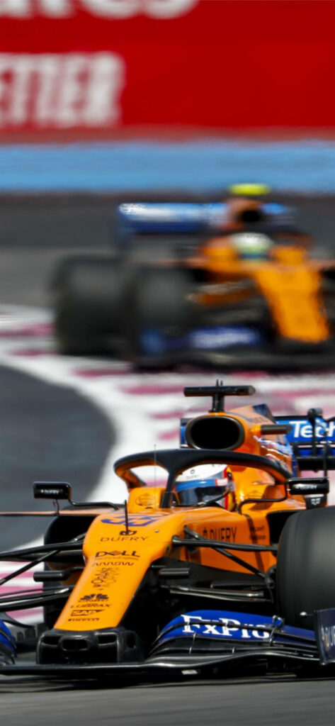 Dynamic McLaren F1 Wallpaper: Bold Yellow Racing Action