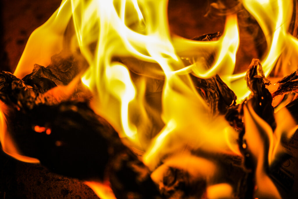 Intense Flames Wallpaper: Rich Orange & Yellow on Dark Background