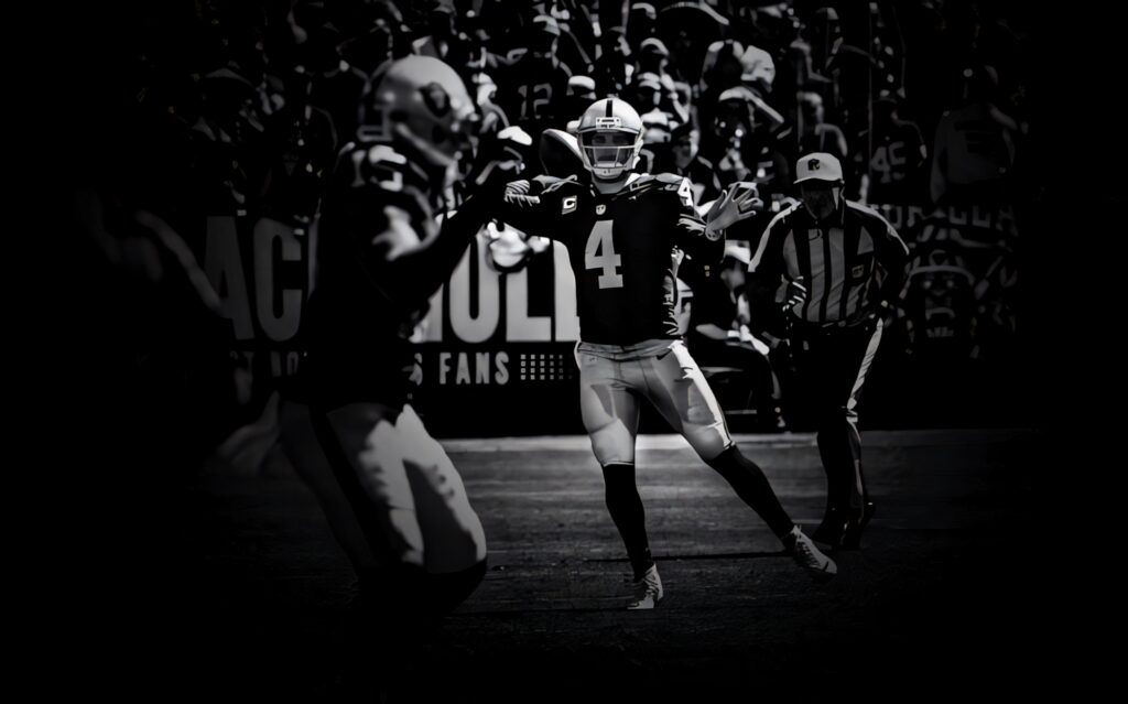 Dynamic Black and White Football Player in Action Wallpaper