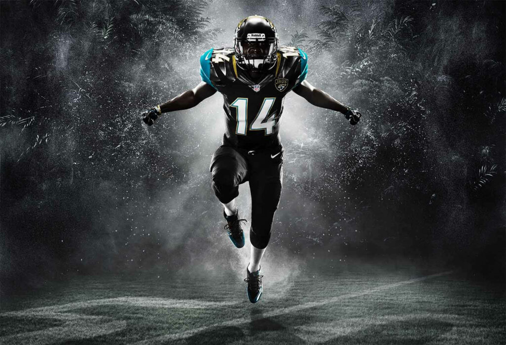 Unleashing the Beast: Jacksonville Jaguars' NFL Star Charging Ahead in Stunning Football Wallpaper