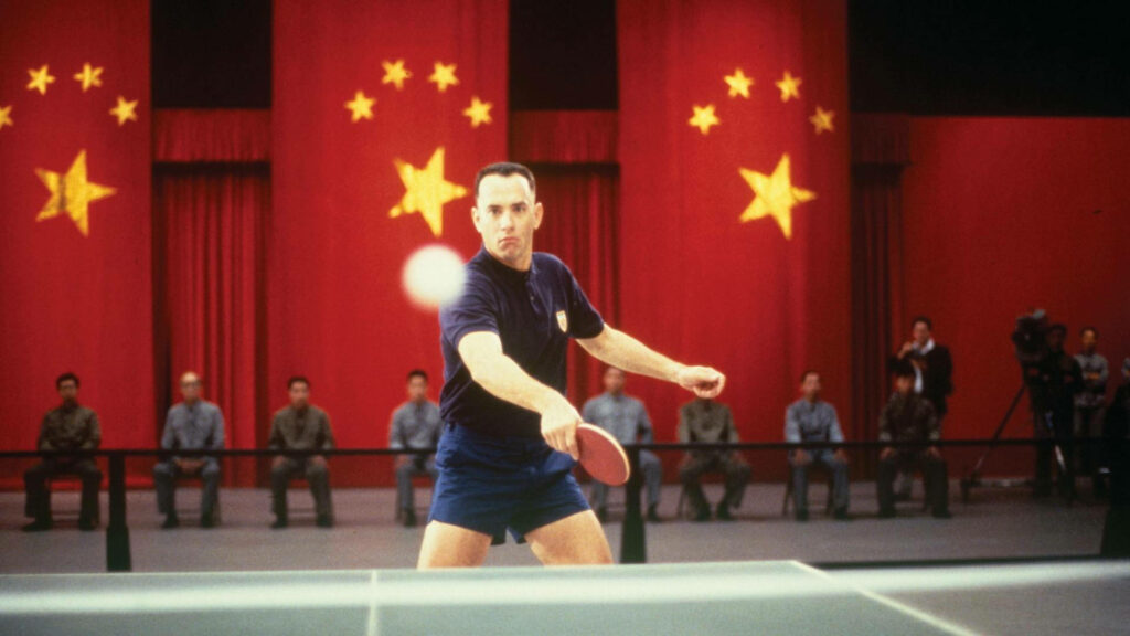 Dynamic Forrest Gump Table Tennis Wallpaper with Red Curtains & Stars