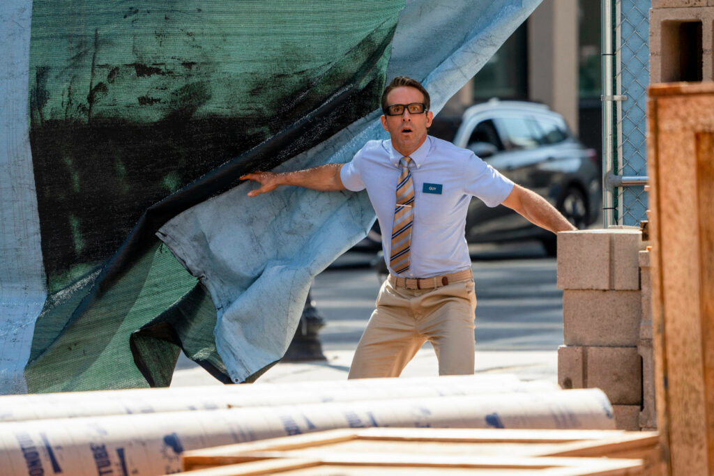 Shocked Scene Wallpaper from *Free Guy* - Action-Packed Background