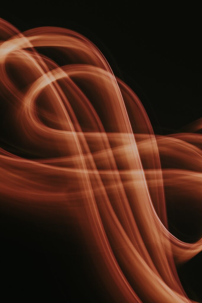 Abstract Freezelight Wallpaper: Dynamic Curves on Dark Background