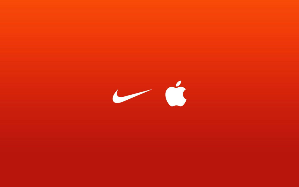 Iconic Coexistence: Nike and Apple's Minimal Logos Collide in Captivating Red Background Wallpaper