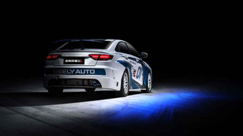 Dynamic Geely Auto Wallpaper: Sleek Car in Blue Lighting Action