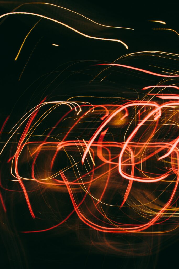 Dynamic Glowing Lines Wallpaper: Mesmerizing Abstract Light Trails