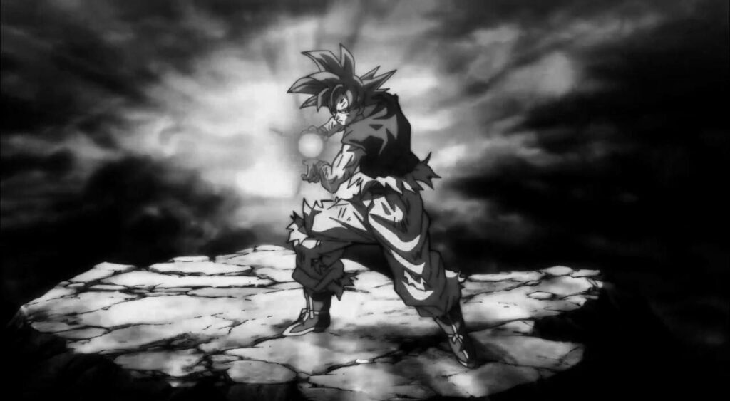 Dynamic Black & White Goku Wallpaper with Intense Cloud Background