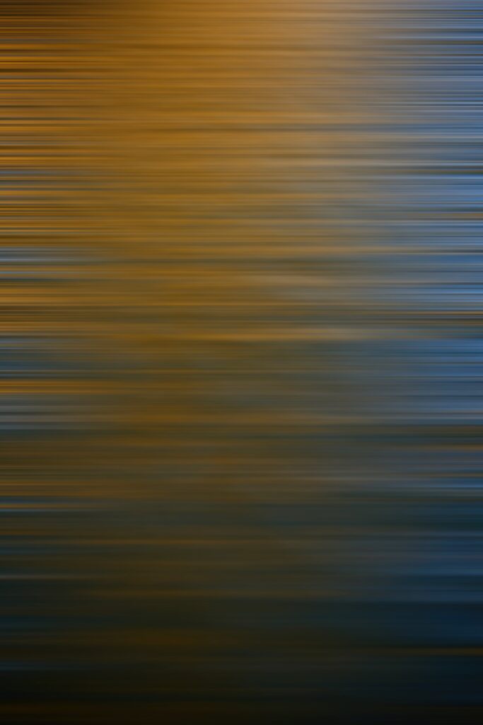 Dynamic Abstract Wallpaper: Warm Orange to Cool Blue Stripes