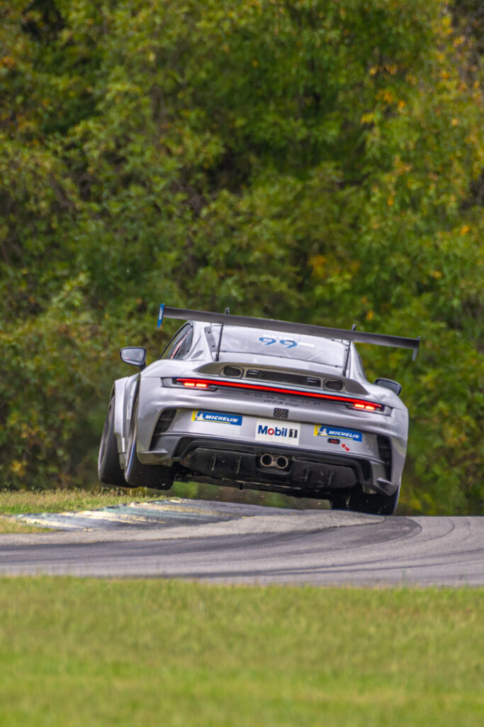 Dynamic Gray Porsche Stunt Wallpaper - Performance & Agility