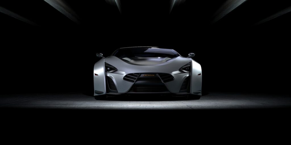 Sleek Gray Sports Car Wallpaper: Dynamic Front View on Dark Background