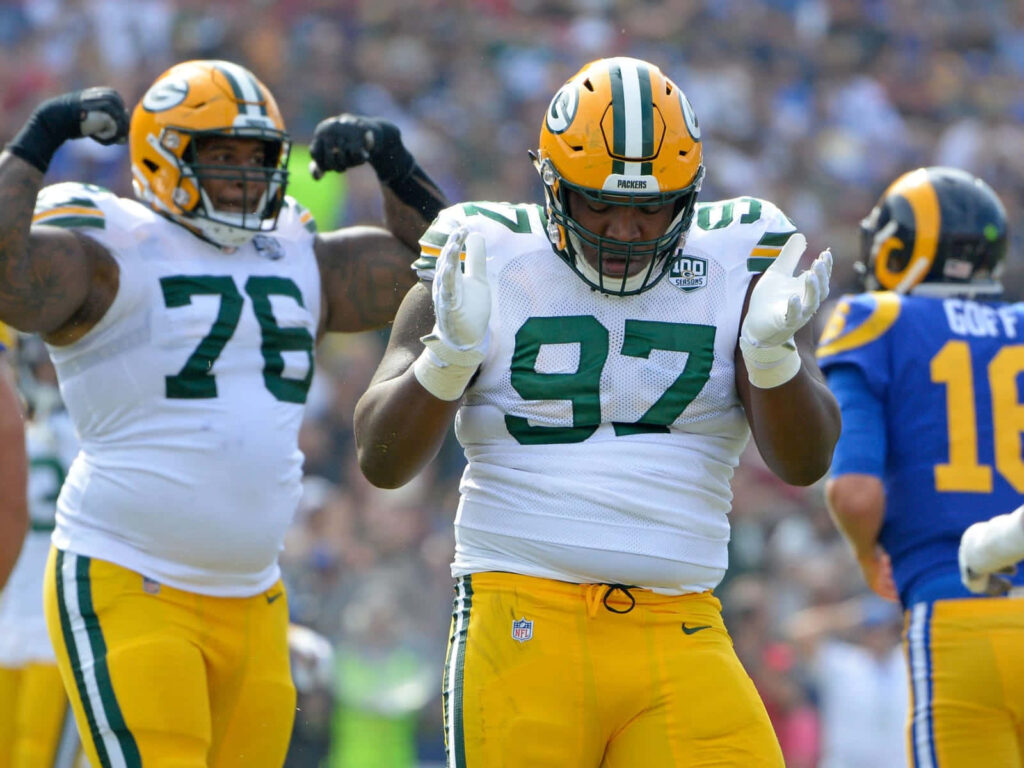 Dynamic Green Bay Packers Wallpaper: Clark & Daniels in Action