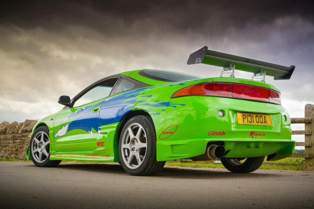 Sporty Mitsubishi Eclipse Wallpaper: Dynamic Design & Bold Decals