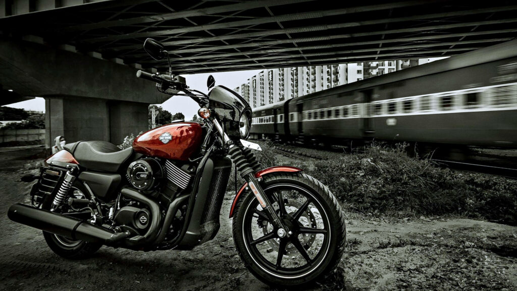 Powerful Harley Davidson Motorcycle Wallpaper with Speeding Train