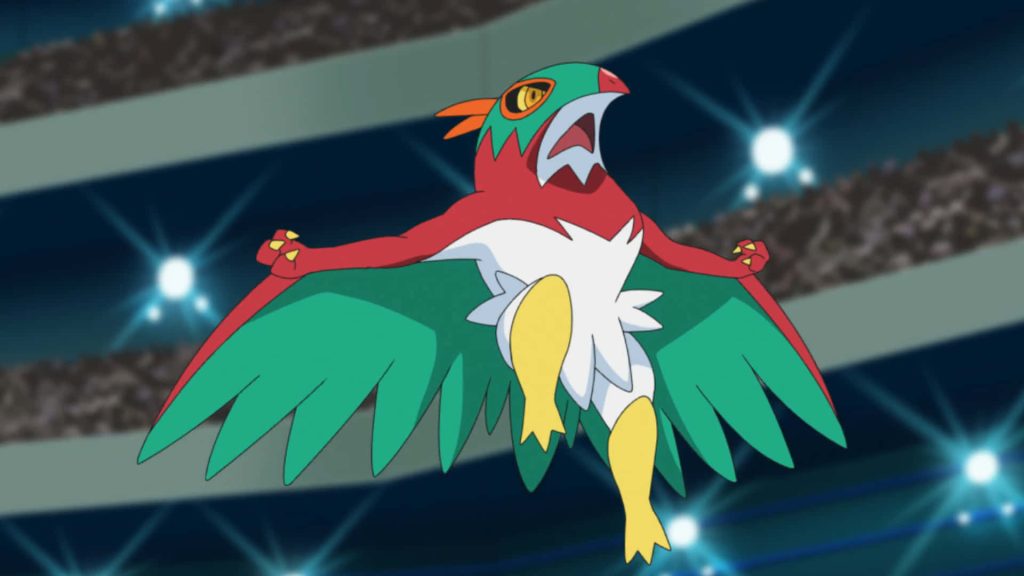 Hawlucha Pokémon mid-leap wrestling pose vibrant red green white design glowing stadium wallpaper