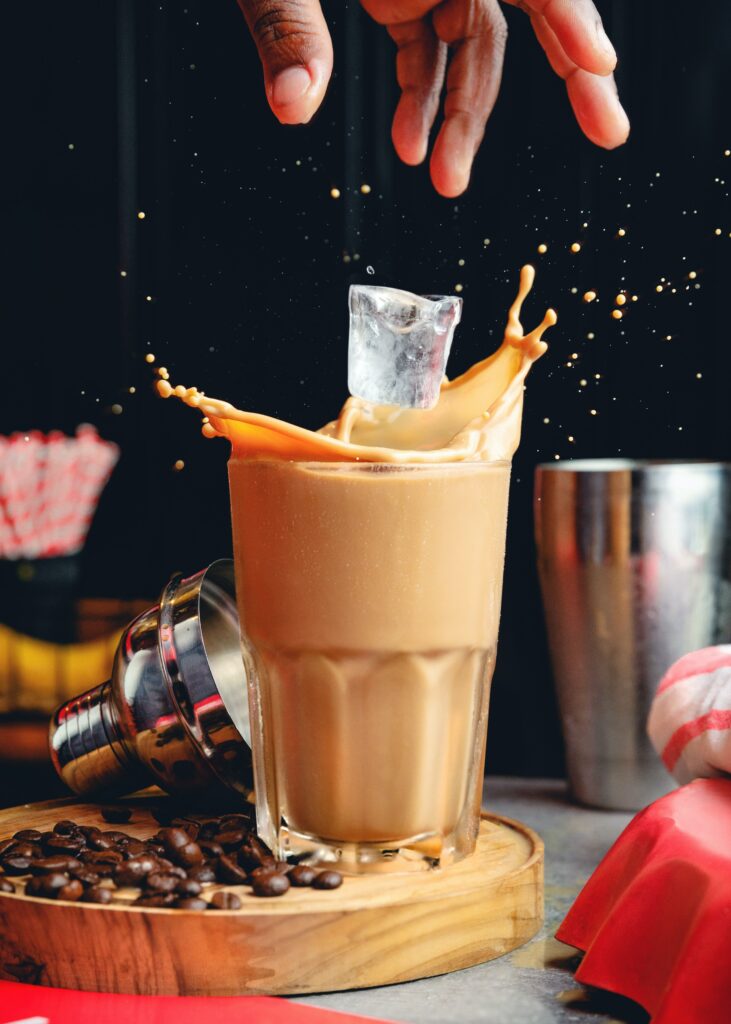 Dynamic Iced Coffee Splash with Beans & Shaker - Wallpaper Background